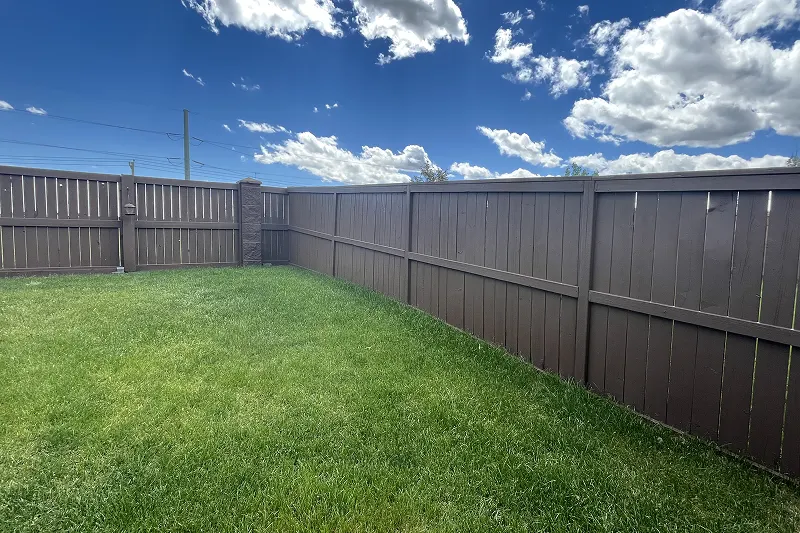 Expert fence staining service in Evanston, Calgary, restoring natural wood beauty and protecting against the elements