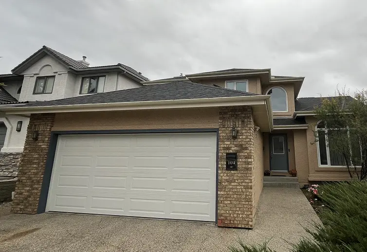 Freshly painted stucco home exterior completed by Calgary stucco painting contractors