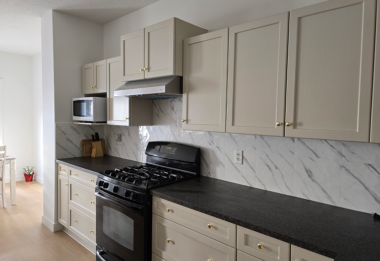 Freshly painted kitchen cabinets with modern color, smooth finish, and enhanced kitchen appearance