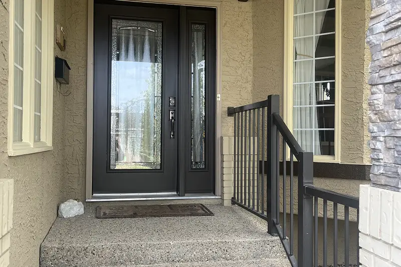 Professional full exterior house painting in Christie Estates, Calgary, featuring a refreshed color scheme and enhanced curb appeal