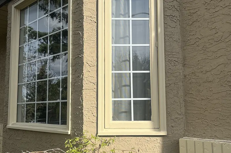 Exterior home transformation through professional painting services in Christie Estates, Calgary, improving appearance and protection