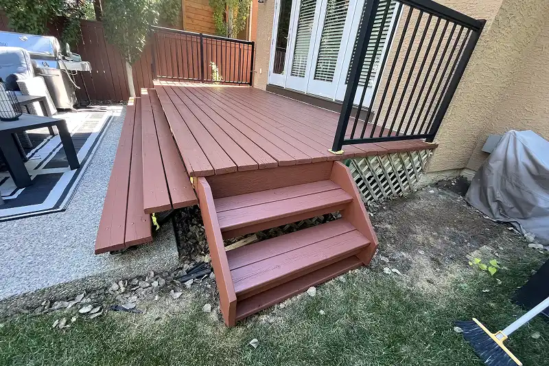 Freshly stained wooden deck in Aspen Woods, Calgary, featuring rich color and long-lasting weather protection