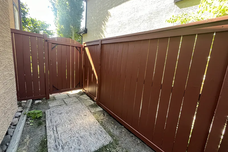 Expert fence staining service in Aspen Woods, Calgary, restoring natural wood appearance and preventing weather damage