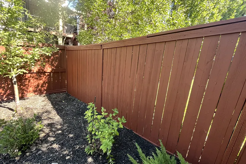 Completed fence and deck staining project in Aspen Woods, Calgary, showcasing premium craftsmanship and a refreshed outdoor space