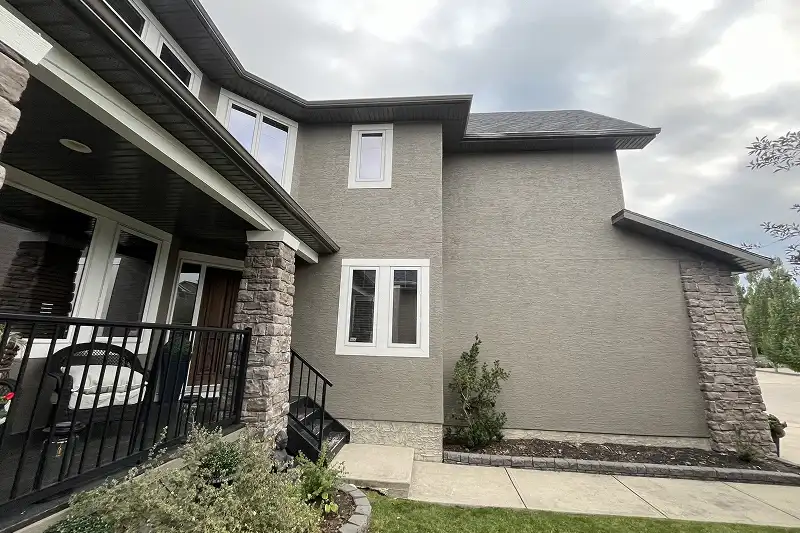 Professional full exterior house painting in Discovery Ridge, Calgary, enhancing curb appeal with a fresh and durable finish
