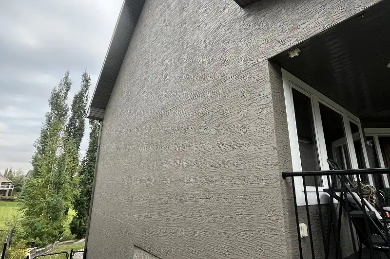 Freshly painted home exterior in Discovery Ridge, Calgary, featuring high-quality paint and expert workmanship