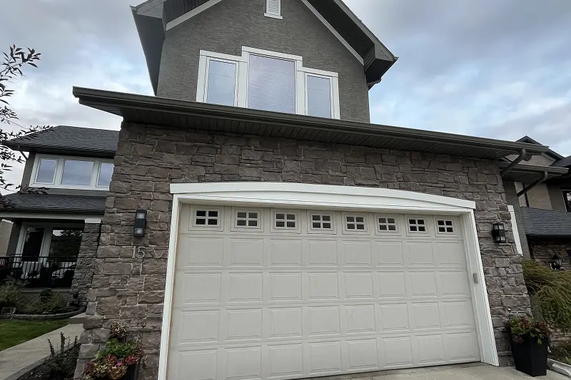 Exterior home painting completed in Discovery Ridge, Calgary, showcasing vibrant colors and long-lasting results