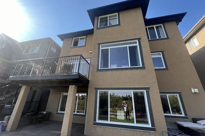 Professional exterior trim and front door painting in Tuscany, Calgary, improving curb appeal and protecting exterior surfaces