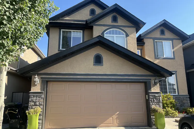 Freshly painted exterior door and trim on a Tuscany, Calgary home, featuring a clean, modern, and durable finish
