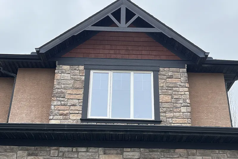 Completed exterior trim and entry door painting in Aspen Woods, Calgary, showcasing a refreshed and well-maintained home exterior