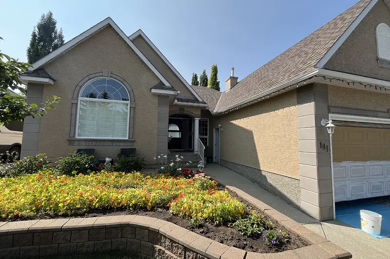 Professional full exterior house painting in Patterson, Calgary, featuring a refreshed appearance and enhanced curb appeal