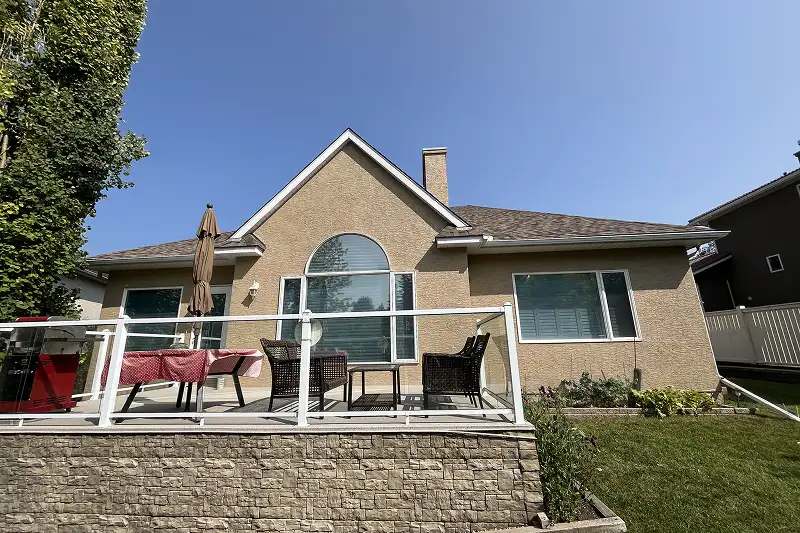 Newly painted house exterior in Patterson, Calgary, with clean lines, vibrant colors, and long-lasting results