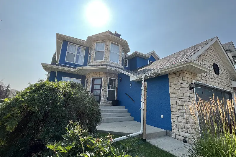 Professional full exterior house painting in Strathcona Park, Calgary, enhancing curb appeal with a fresh and long-lasting finish