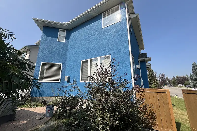 Complete exterior house painting project in Strathcona Park, Calgary, showcasing a modern appearance and detailed finishing