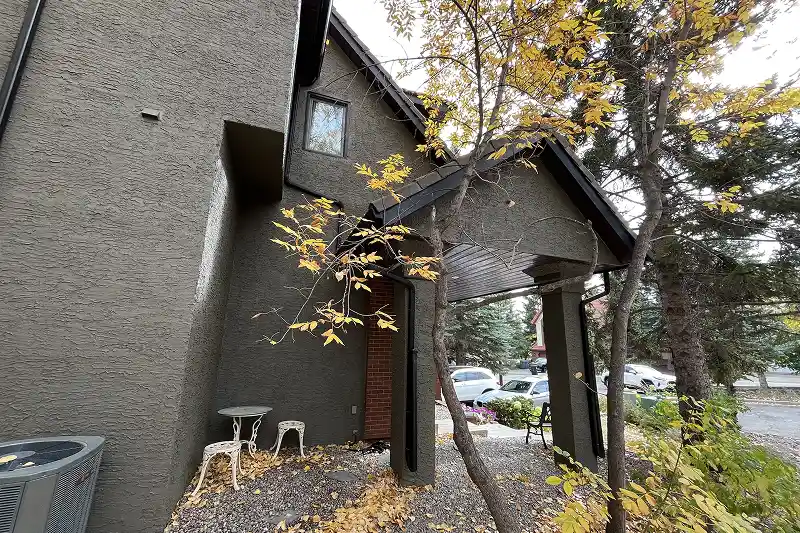 Freshly painted home exterior in Coach Hill, Calgary, with premium paint and a durable weather-resistant finish