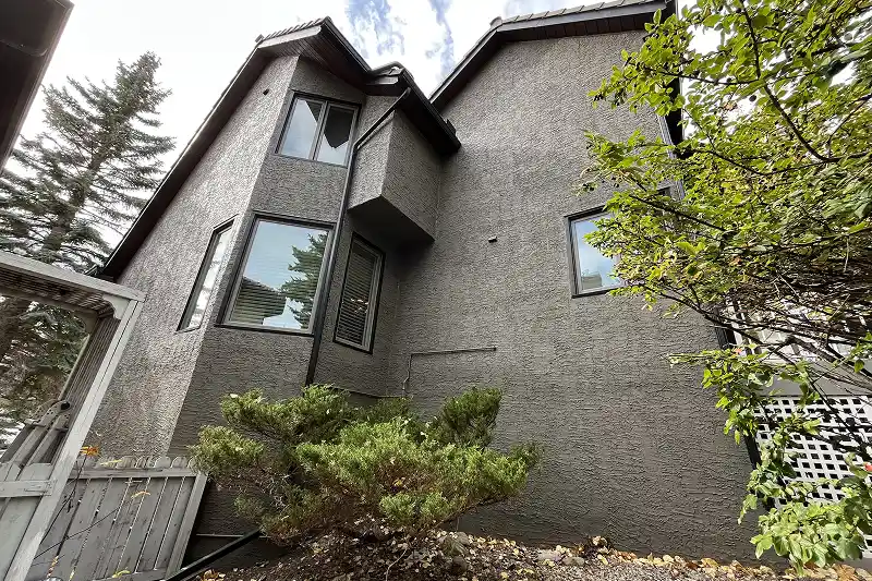 Exterior home transformation through professional painting services in Coach Hill, Calgary, delivering a clean and modern appearance