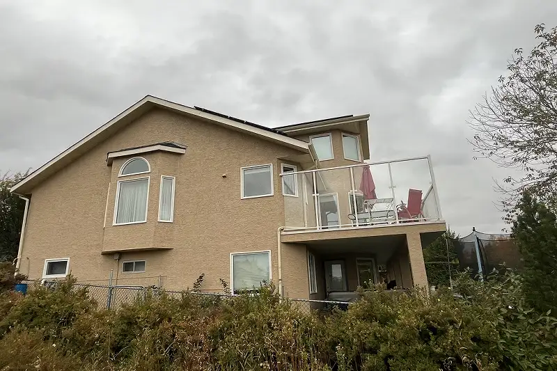 Newly painted house exterior in Scenic Acres, Calgary, with clean lines, vibrant colors, and lasting results