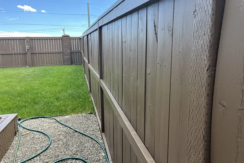 Freshly stained wooden deck in Evanston, Calgary, featuring a rich finish and superior weather protection