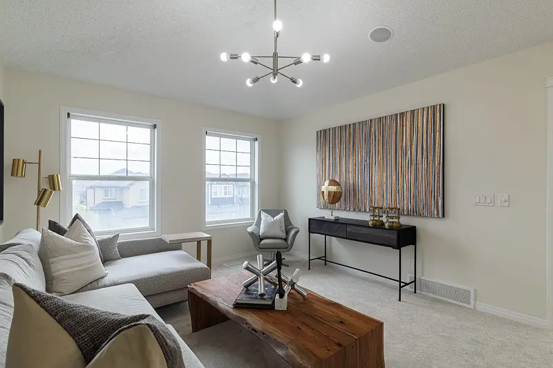 Bright and airy residential interior painting by Color Works Painting on living room walls, highlighting a warm neutral color palette.