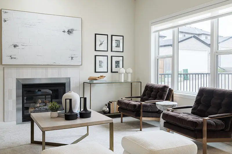 Custom living room wall painting by Color Works Painting featuring a flawlessly finished white accent wall and fireplace surround.