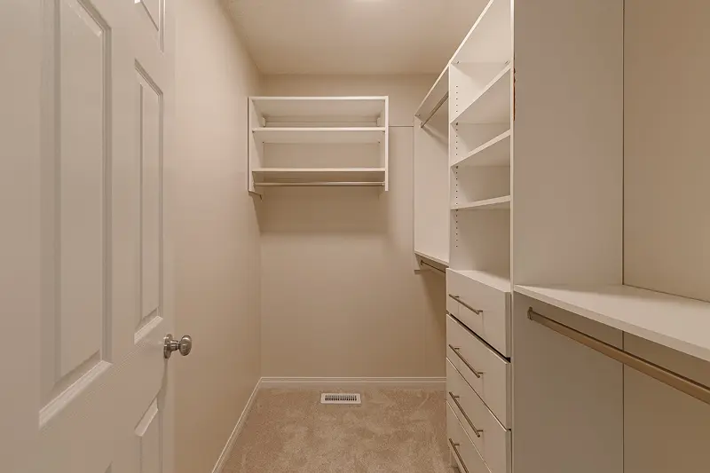 Precision storage room and walk-in closet interior painting by Color Works Painting using a durable, clean off-white paint finish.