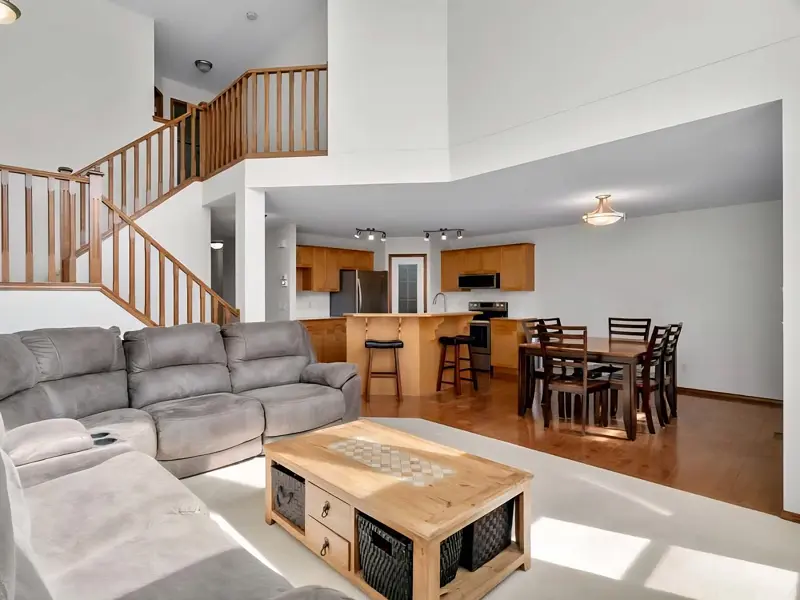 Professional house painting in Calgary creating a clean and inviting open-concept living and dining space.