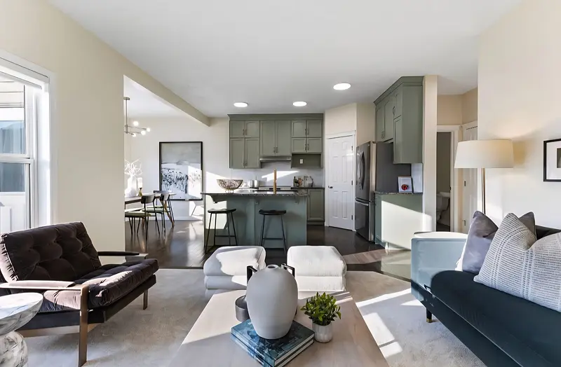 Recently painted Calgary home interior featuring contemporary living room, kitchen, and soft neutral color palette.