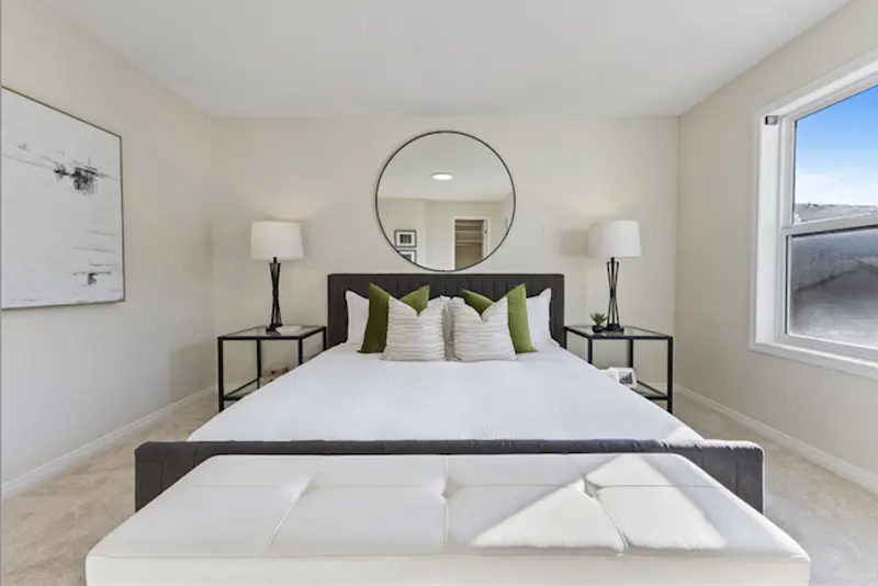 Beautifully painted Calgary bedroom with bright walls, modern décor, and a calm, welcoming atmosphere.