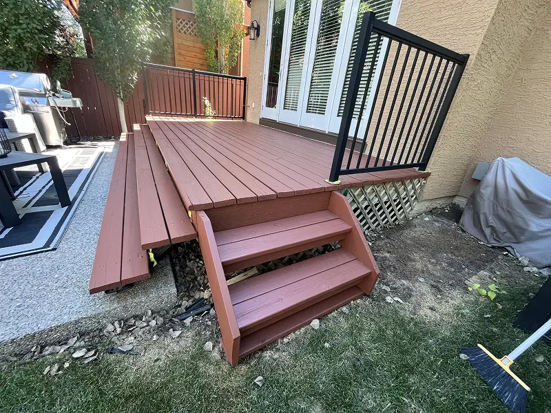Calgary deck staining services showcasing a beautifully restored backyard deck with premium wood stain and long-lasting weather protection.