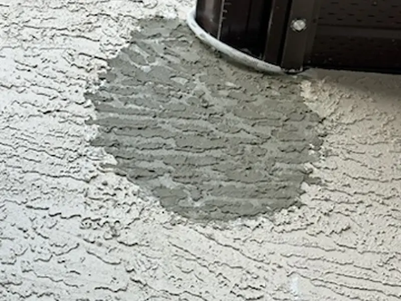 Damaged stucco wall requiring professional stucco repair in Calgary