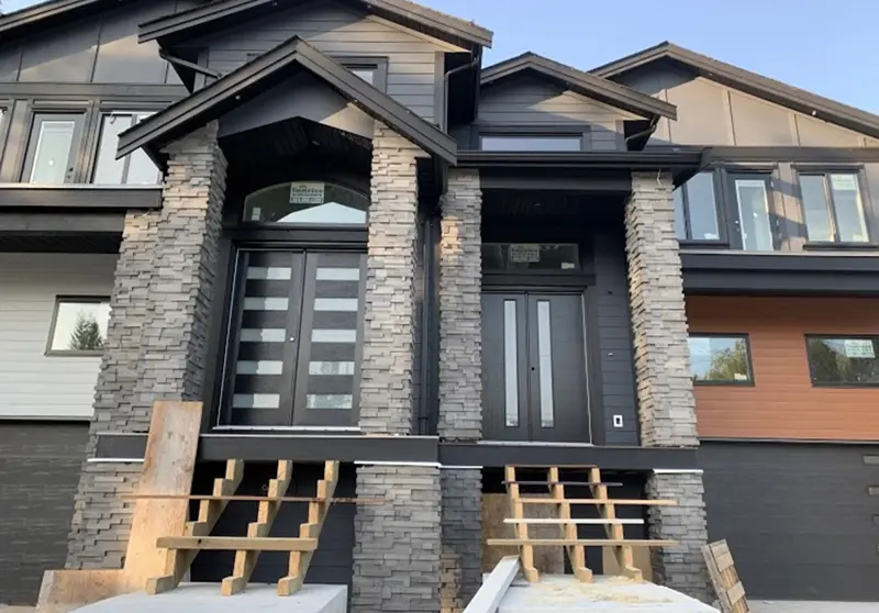 Modern two-story house featuring durable exterior siding paint built to withstand Alberta weather conditions